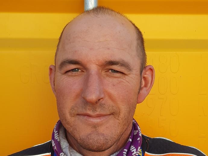 male employee in orange ppe with lanyard