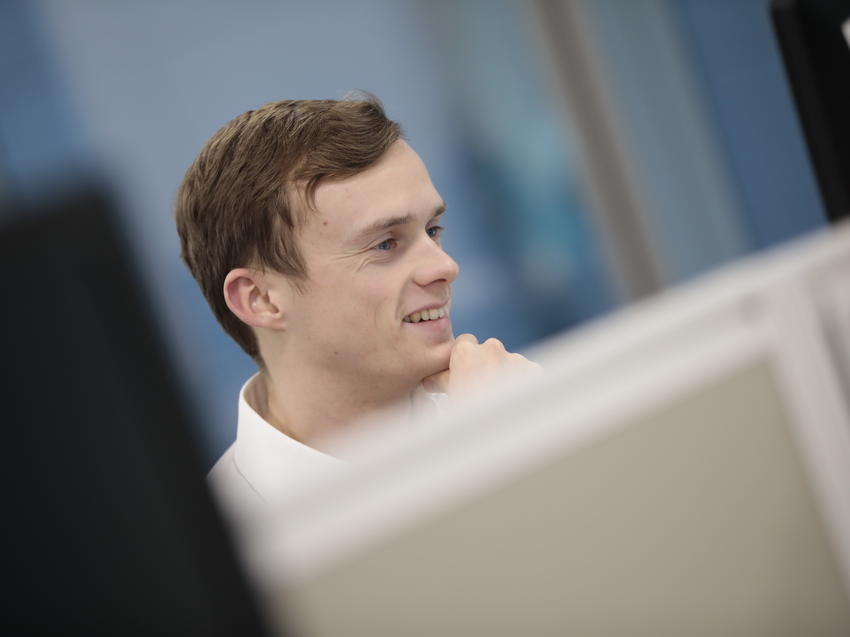 keller male employee looking at computer screen