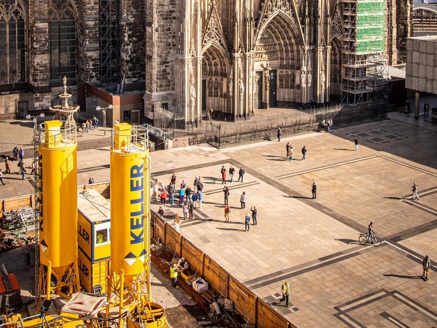 yellow keller branded tanks in front of cathedral