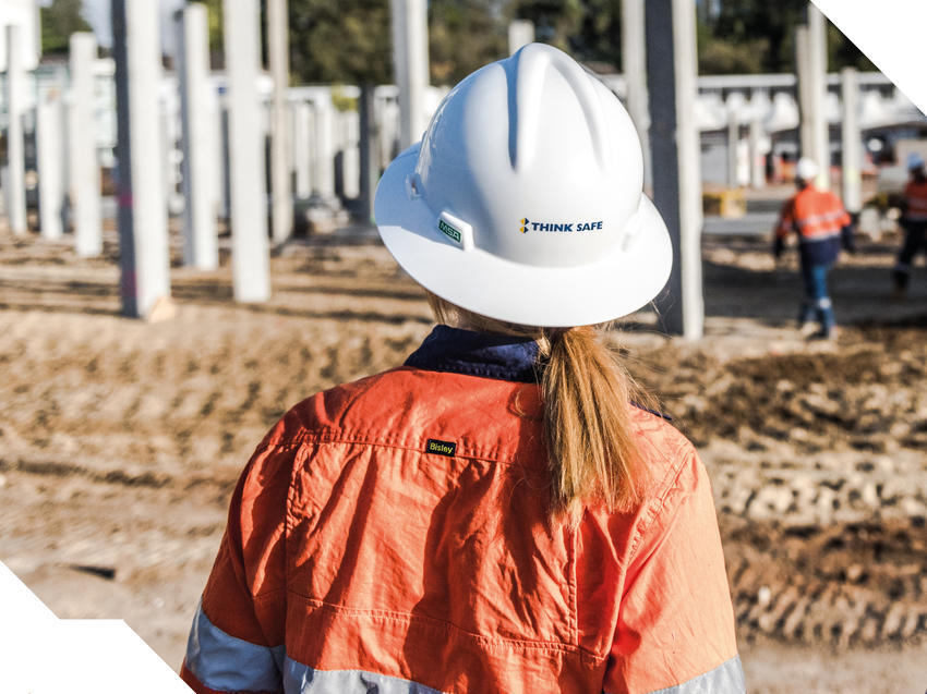 Keller employee wearing hard hat with the words Think Safe